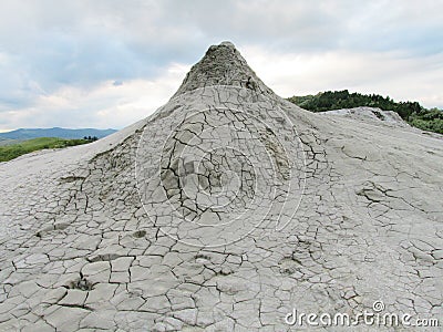 Mud volcano erupting with dirt Stock Photo